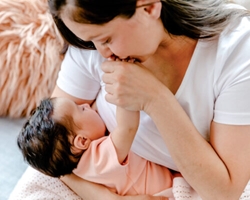 Canvas Art: Breastfeeding Mother Kissing Hand 