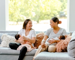 Canvas Art: Breastfeeding Mothers on Couch 