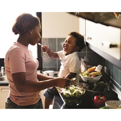 Mom and Child Cooking In Kitchen Canvas Print (20x16) 